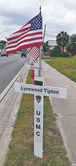 Memorial Day recognition crosses lining US 129